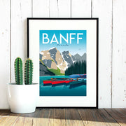 Travel poster of Banff National Park in Canada with view of lake, mountain and canoes